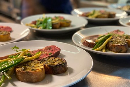 Enjoy beef steak dinner. Photo.