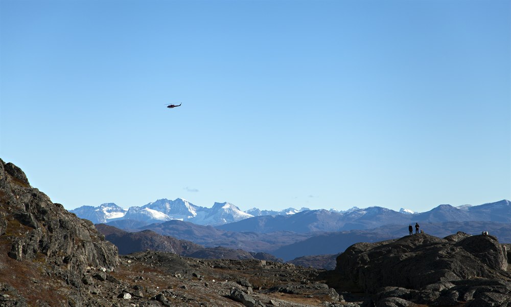 Helicopter sightseeing over mountain. Photo.