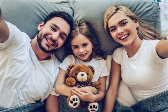 family of three in one bed