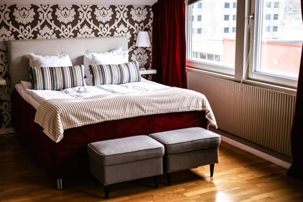 A bed in a Deluxe double room.