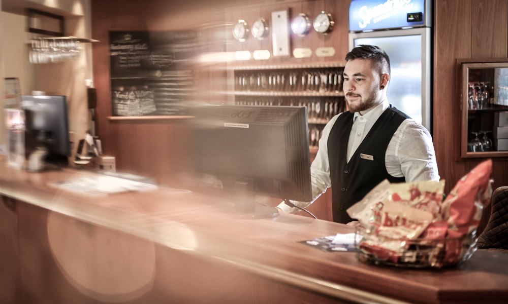 A male employee at the reception.