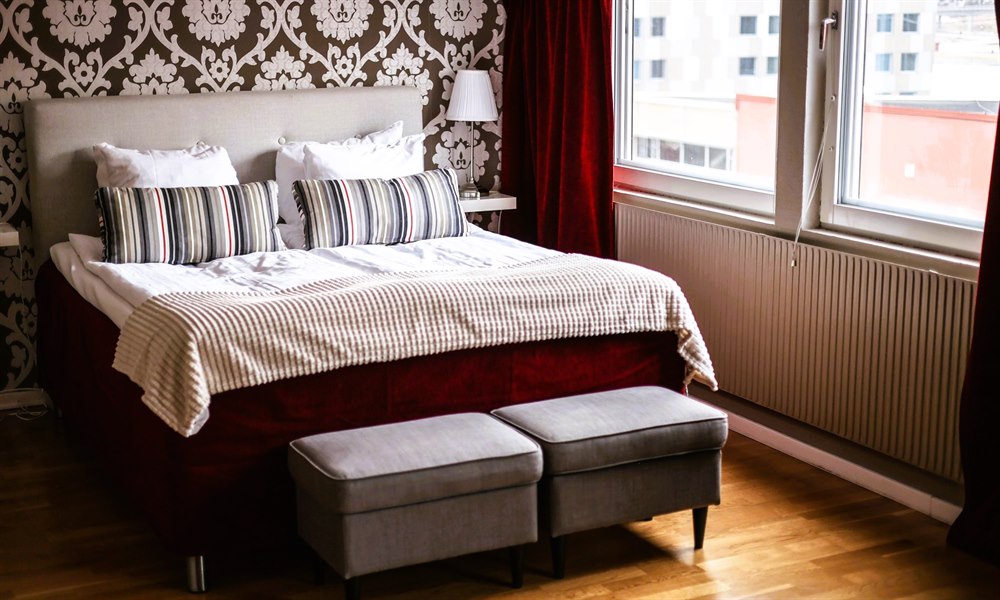 A bed in a Deluxe double room.