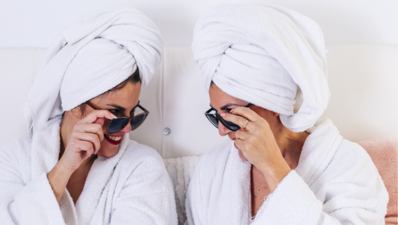 Women in hotel with sunglasses. Photo