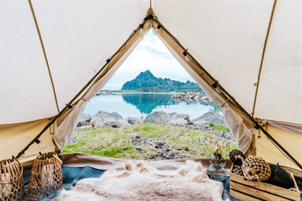 View over water from tent in Lofoten. Photo.